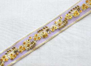 jacquard woven motif adorns this organza ribbon. Then tiny beads 