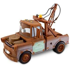  Disney Cars 2 Transforming Mater Vehicle: Toys & Games