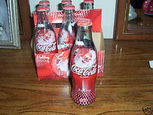 PACK OF COCA COLA BOTTLES /COKE IN THEM UNOPENED 2004  