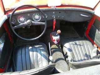   . 6,000 RPM tach. Good side windows and new top. See Lower Pictures