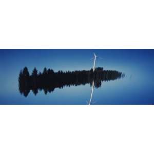 Reflection of a Wind Turbine and Trees on Water, Black Forest, Germany 