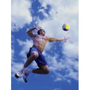  Low Angle View of a Man Playing Beach Volleyball Stretched 